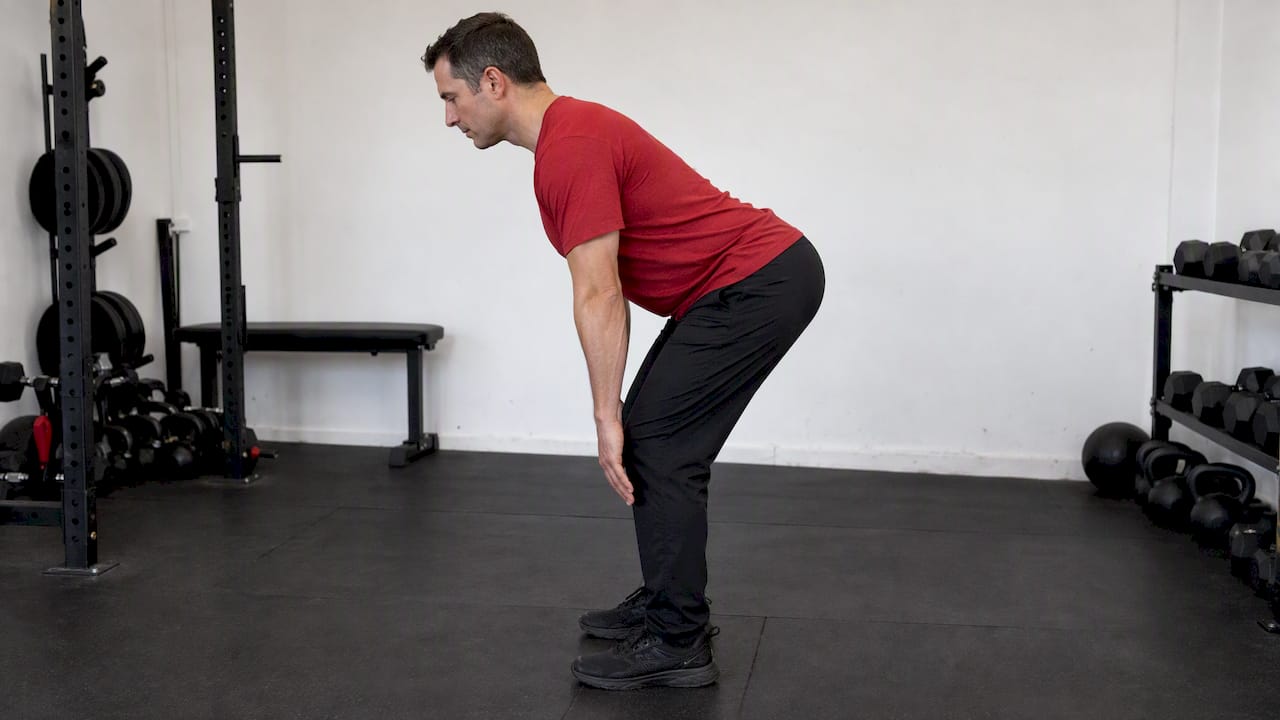 Adult demonstrating a controlled bodyweight hip hinge